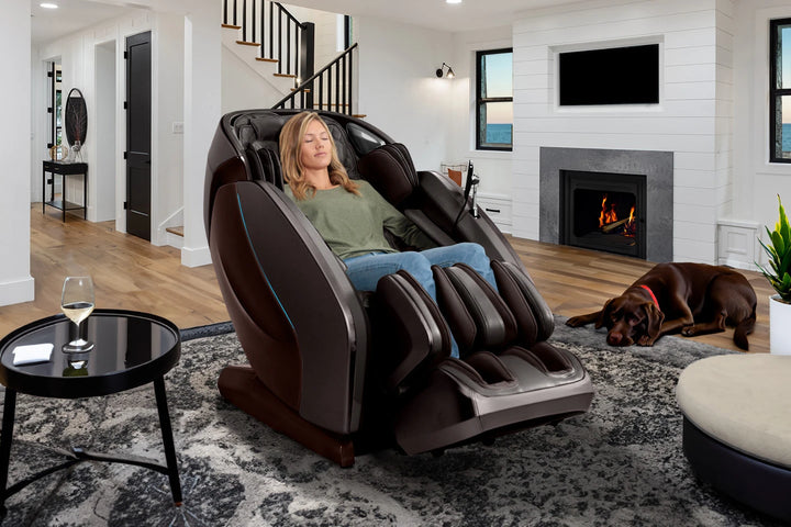 Kyota Hatsumei M900 4D AI massage chair in Dark Brown in a living room