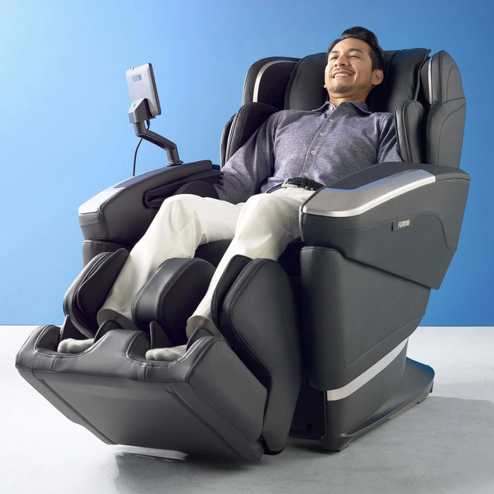 Fujiiryoki Cyber Relax AI JP-4100 with user positioned in the foot and leg massage system